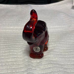 Fenton red trunk up, elephant.